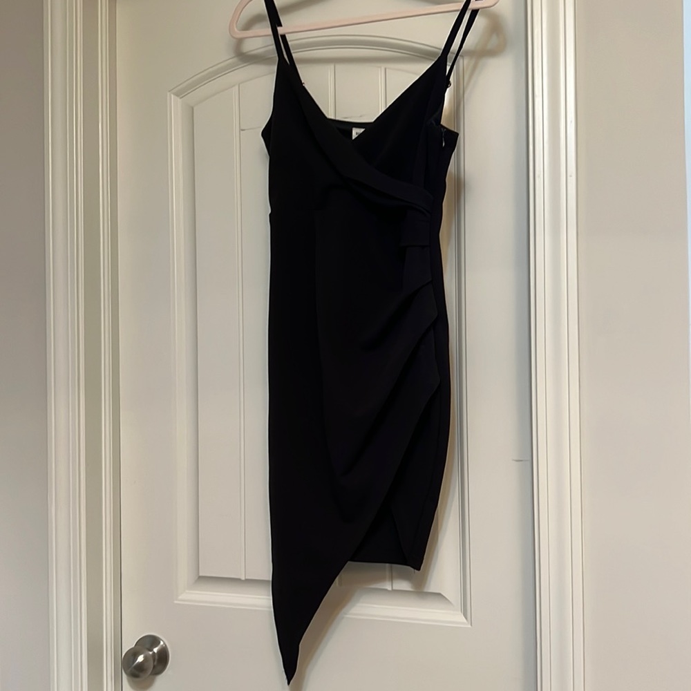 Back mini dress with asymmetrical front. Size M but fits like a small